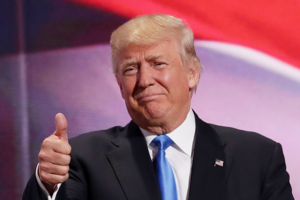 CLEVELAND, OH - JULY 18:  Presumptive Republican presidential nominee Donald Trump gives a thumbs up to the crowd after his wife Melania delivered a speech on the first day of the Republican National Convention on July 18, 2016 at the Quicken Loans Arena in Cleveland, Ohio. An estimated 50,000 people are expected in Cleveland, including hundreds of protesters and members of the media. The four-day Republican National Convention kicks off on July 18.  (Photo by Chip Somodevilla/Getty Images)